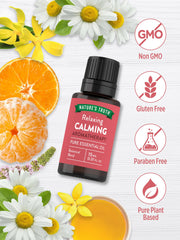 Close-up of calming essential oil ingredients: orange, tangerine, ylang-ylang, patchouli, chamomile
