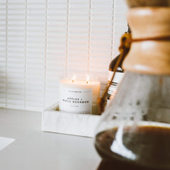 Lifestyle shot of the candle in a cozy living room setting