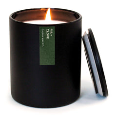 Calyan Wax Co. Fir & Clove candle in a 10.2oz black tumbler jar