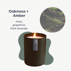 Close-up of the matte black tumbler jar with the Oakmoss & Amber candle