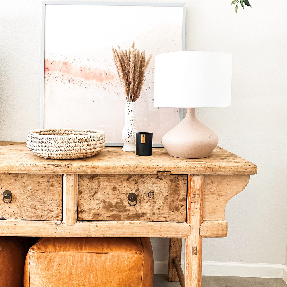 Candle in a cozy living room setting for home ambiance