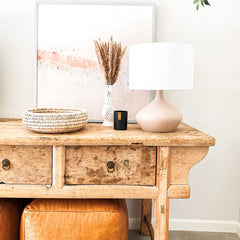 Candle in a cozy living room setting for home ambiance