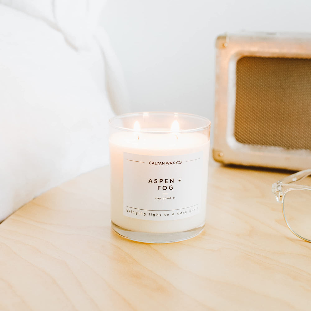 Candle in a cozy living room setting for ambiance