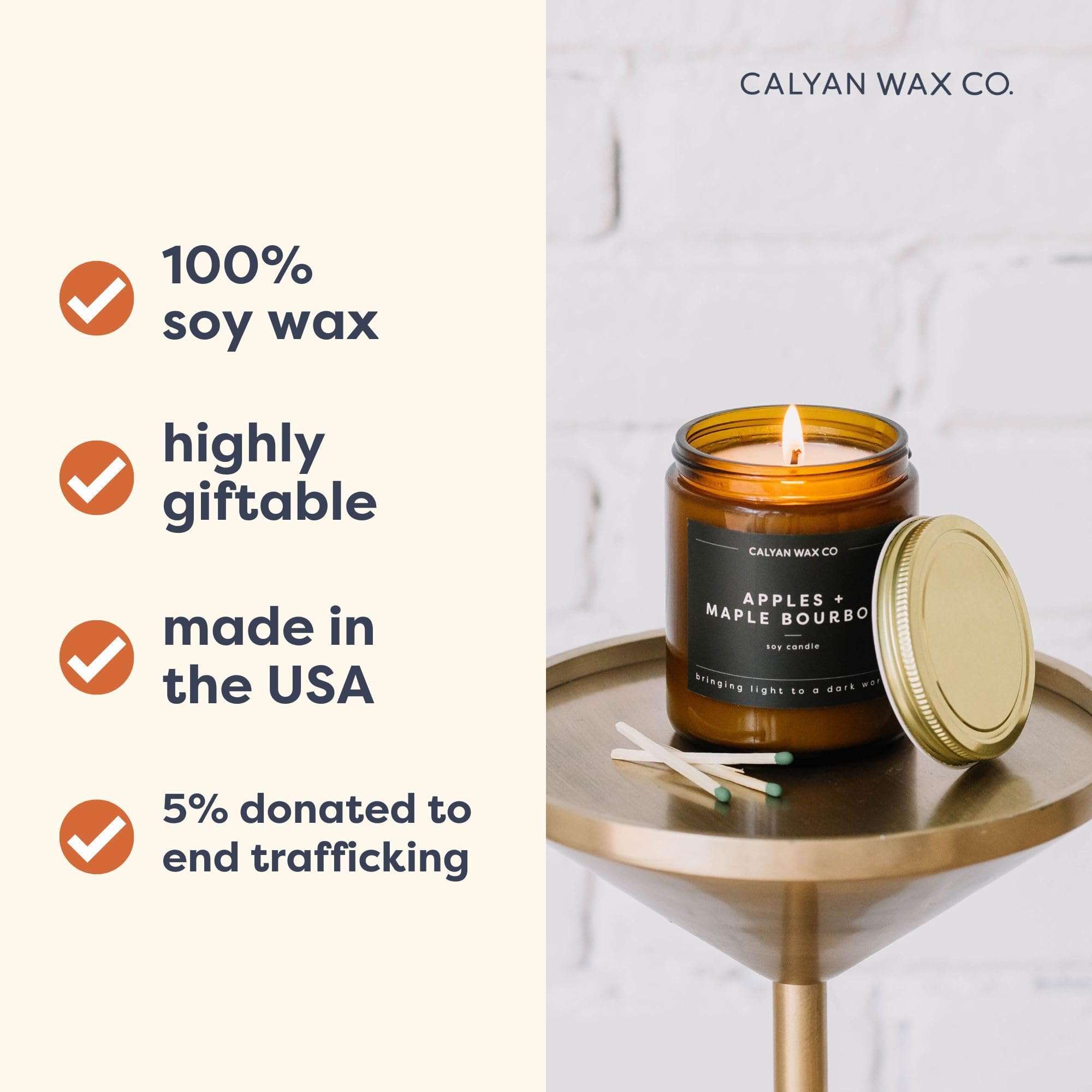 Cedar & Tobacco candle lit with warm amber glow