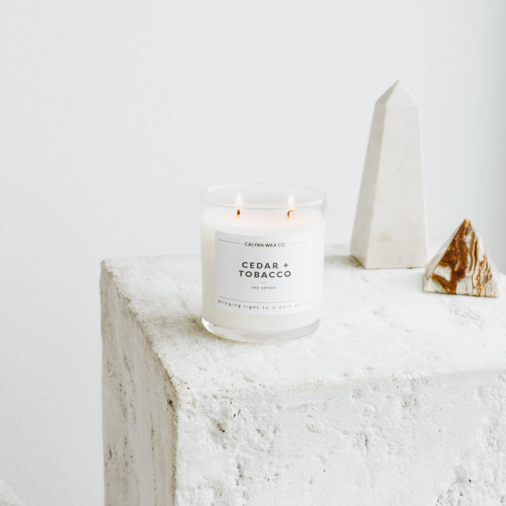 Calyan Wax Co. Cedar & Tobacco candle in living room setting
