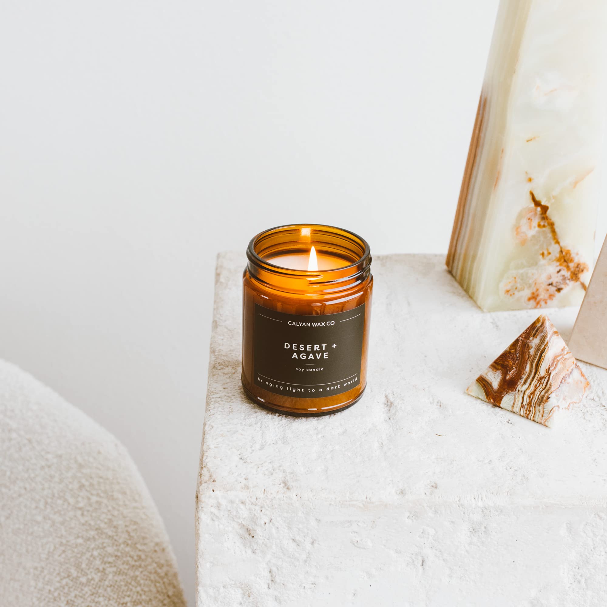 Amber glass jar of Calyan Wax Co candle