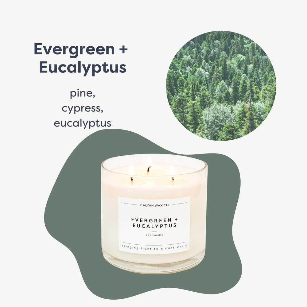 Close-up of 3-wick candle with evergreen and eucalyptus fragrance