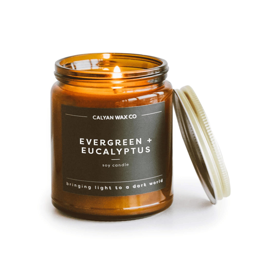 Calyan Wax Co. Evergreen & Eucalyptus candle in amber glass jar — front view