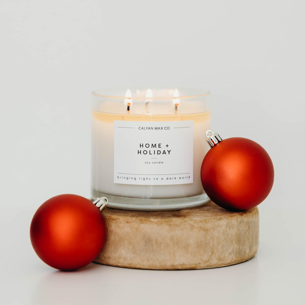 Three-wick candle burning with even, clean flame