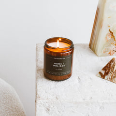 Warm home setting with candle as decor.