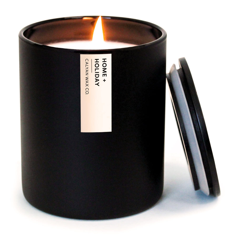 Calyan Wax Co home holiday candle in black 10.2oz tumbler - front view