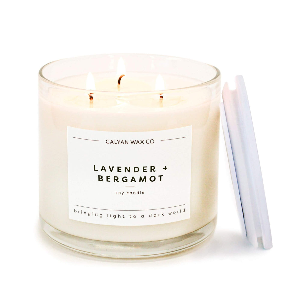 Lavender and Bergamot Calyan Wax Co. 3-wick candle in a 14.9oz clear glass jar