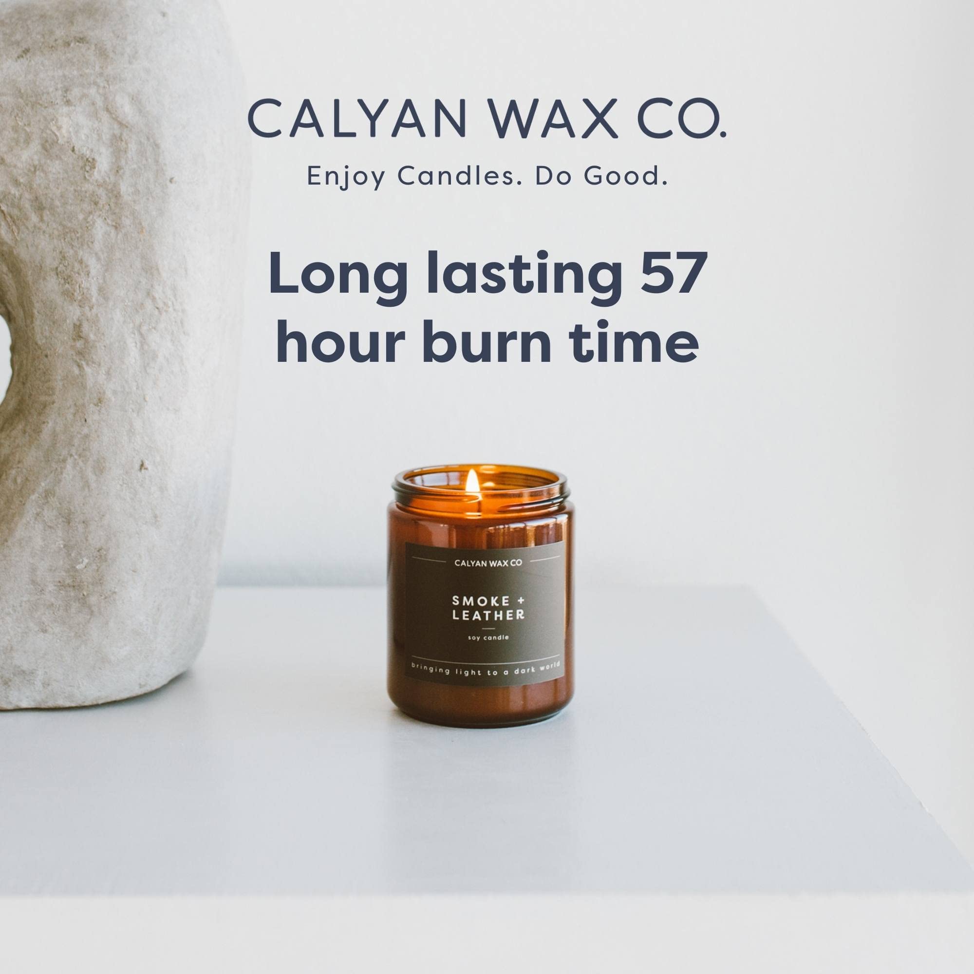 Hand-poured soy wax candle in amber glass jar