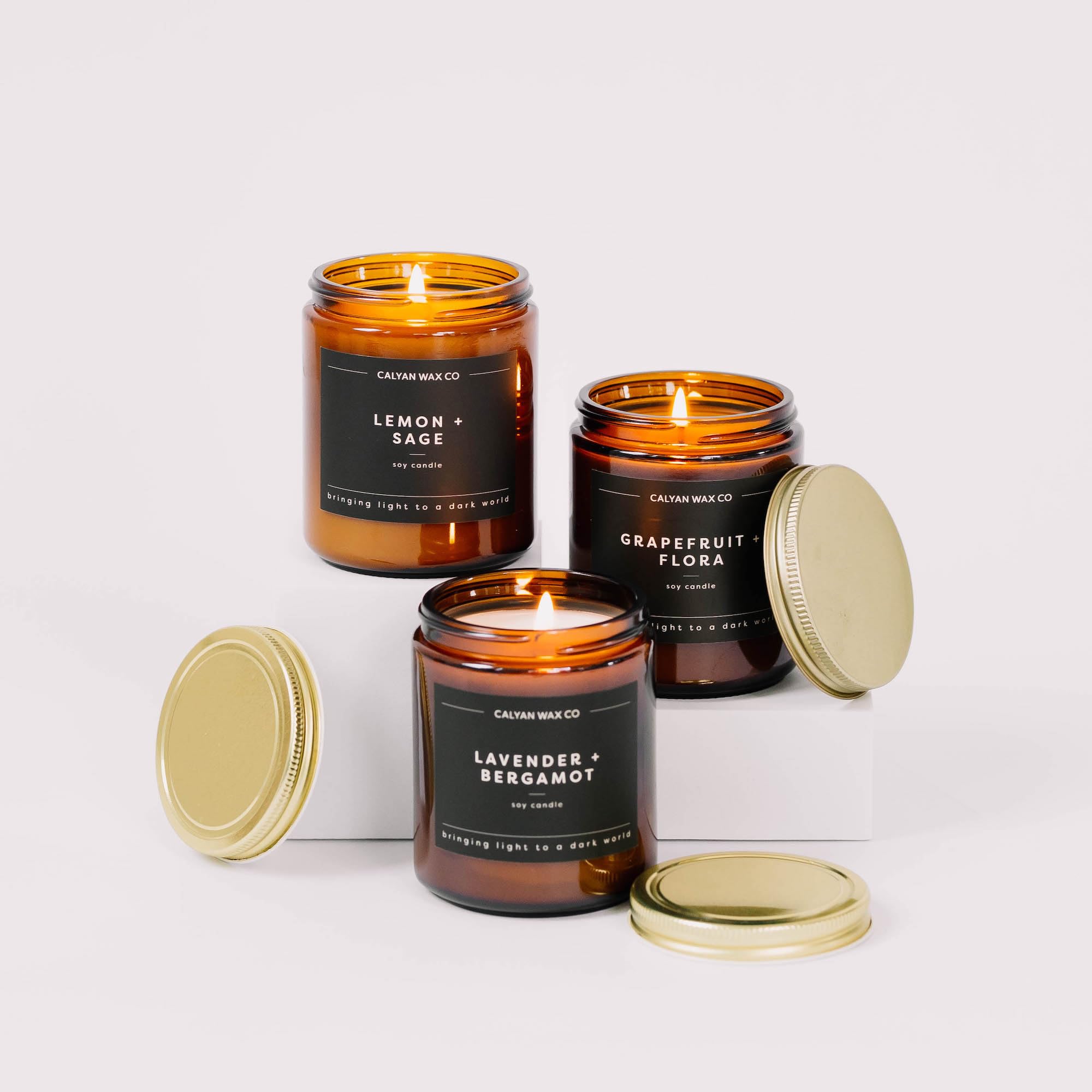 Unlit candle in amber glass jar with luxurious finish