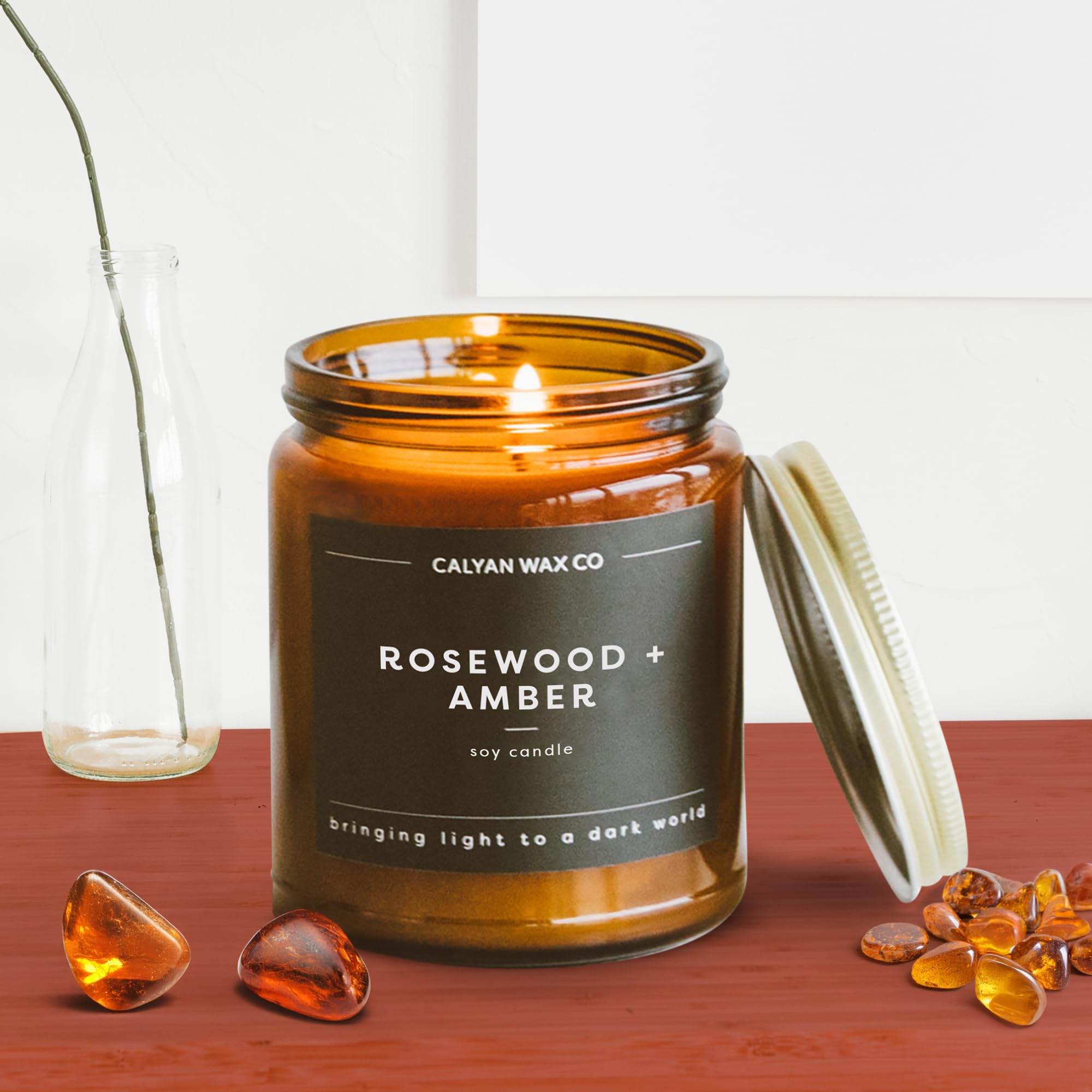 Rosewood and Amber candle on a shelf