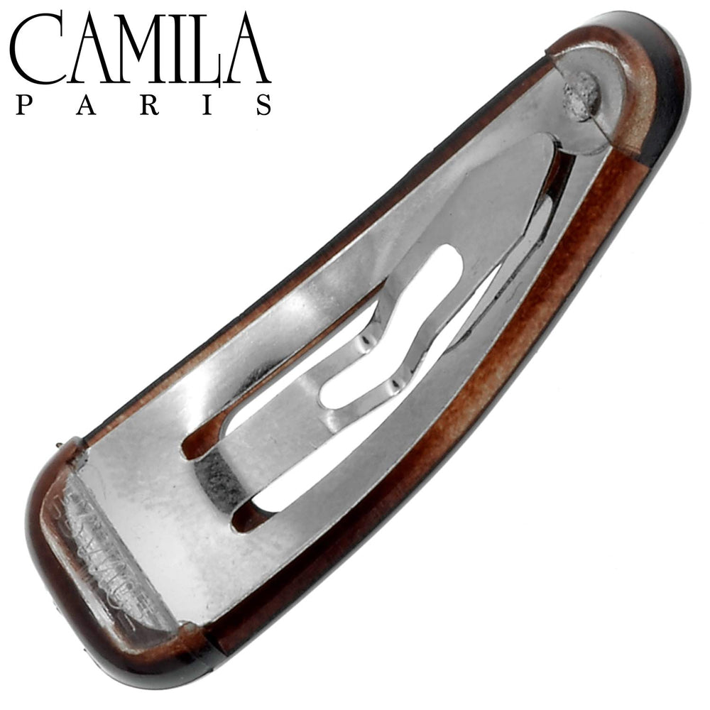 Camila Paris AD89/2 barrette worn for a tidy, face-framing style.