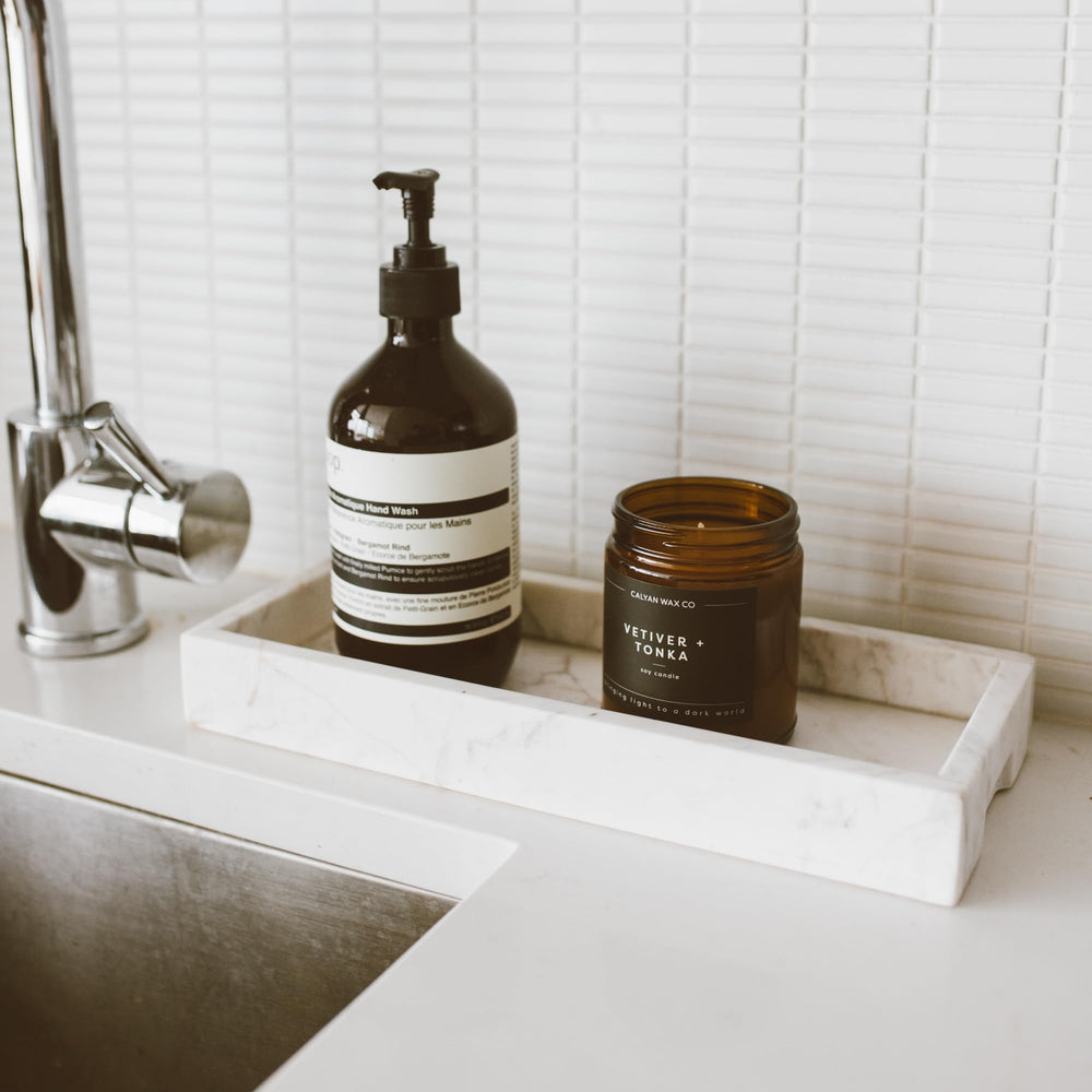 Lifestyle image of Vetiver & Tonka candle in a cozy room
