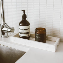 Lifestyle image of Vetiver & Tonka candle in a cozy room