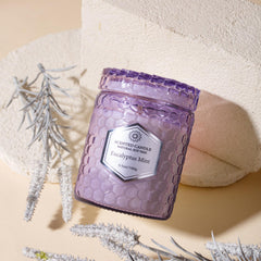 Sandalwood Rose scented candle in purple embossed cup