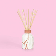 Capri Blue logo and modern marble diffuser design