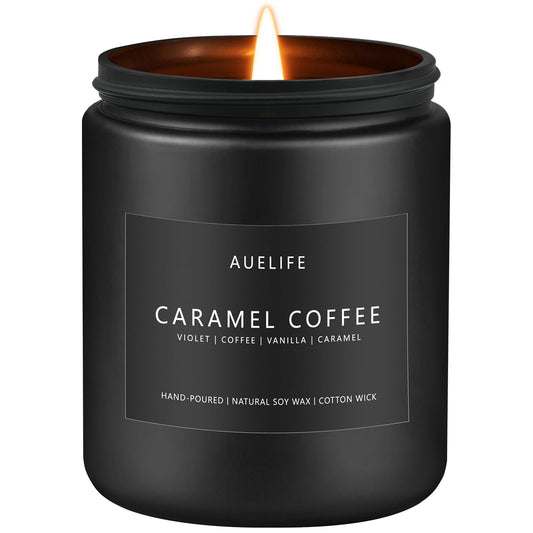Caramel Coffee Candle in a matte black container on a wooden surface