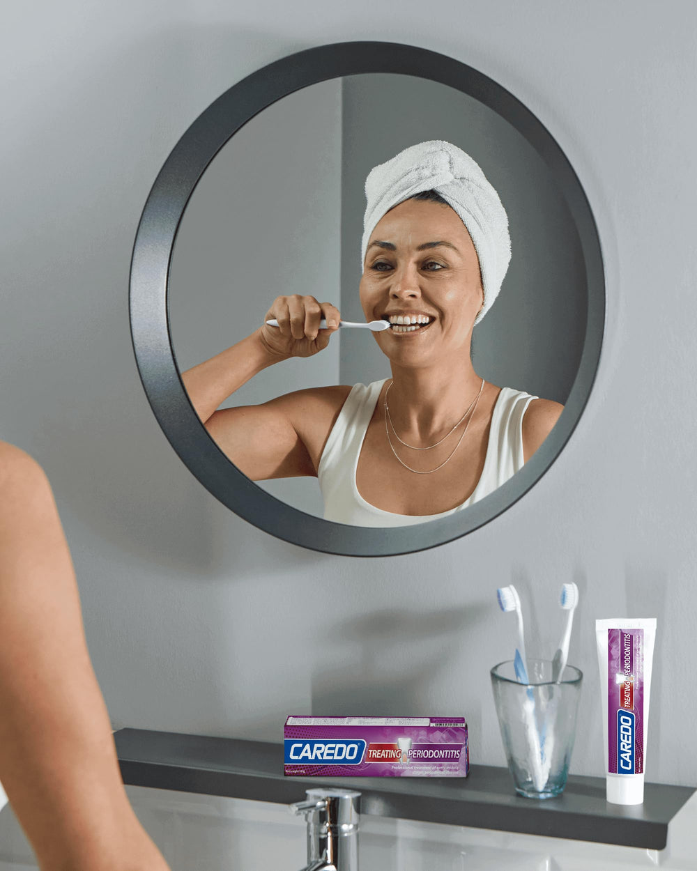 Smiling person with healthy gums after using CAREDO