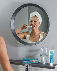 Packaging of CAREDO toothpaste showing two 100 g tubes