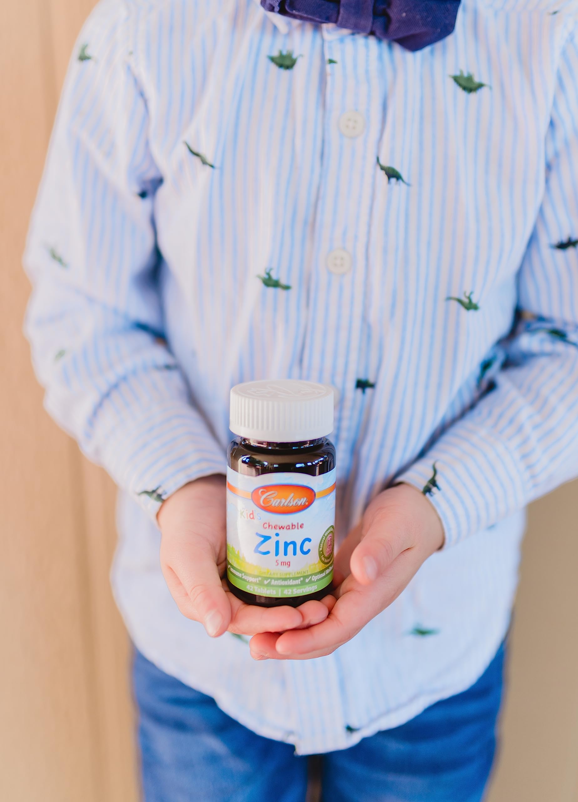 Child selecting Carlson Kid's zinc chewables