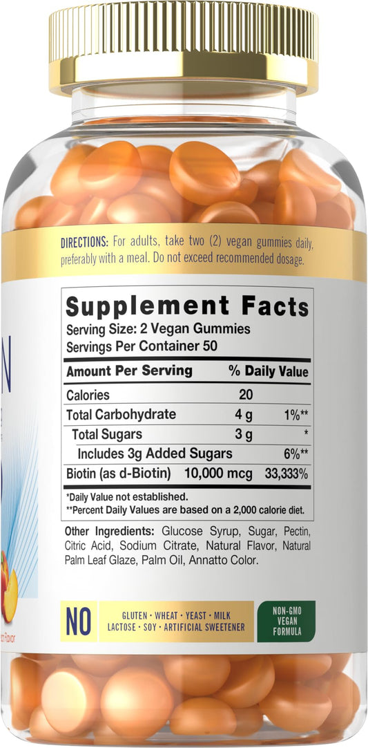 Peach-flavored biotin gummies near bottle cap