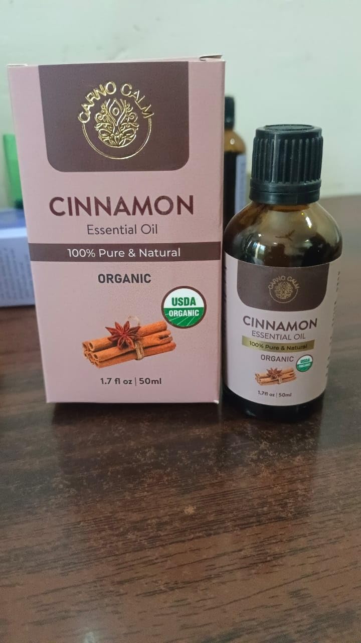Amber glass bottle of Carno Calm Cinnamon Essential Oil