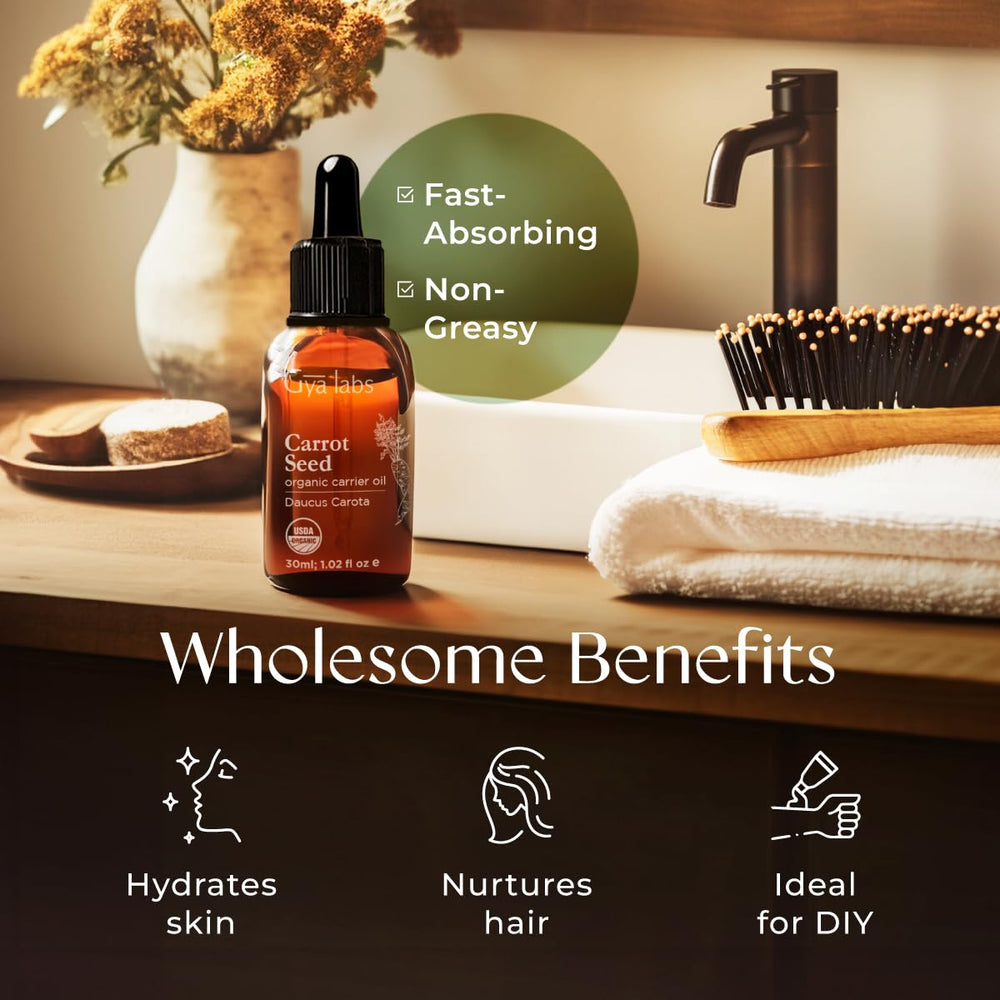 Carrot seed oil blends with essential oils