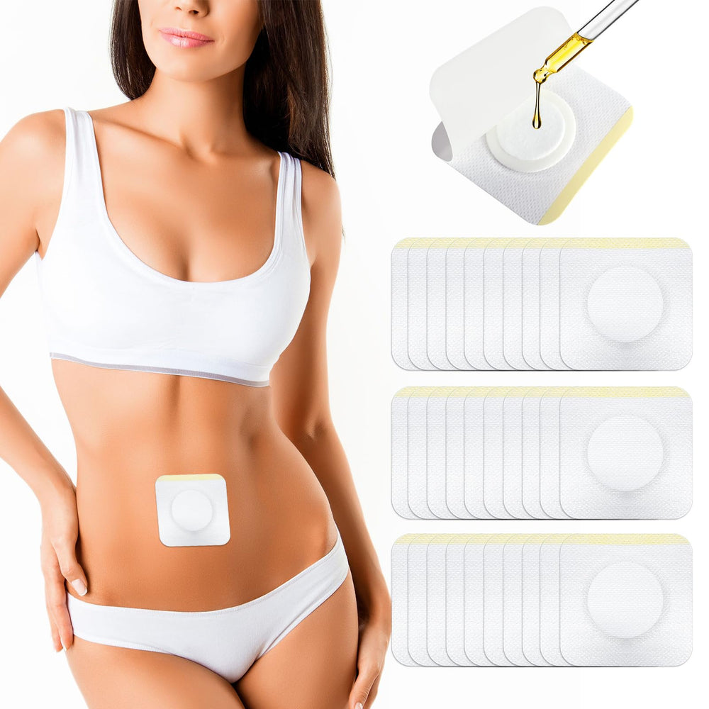 Disposable castor oil patch wrap placed on belly button