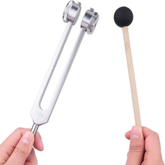 CBCJIEHUXL tuning fork near ear highlights ethereal sound for therapy.