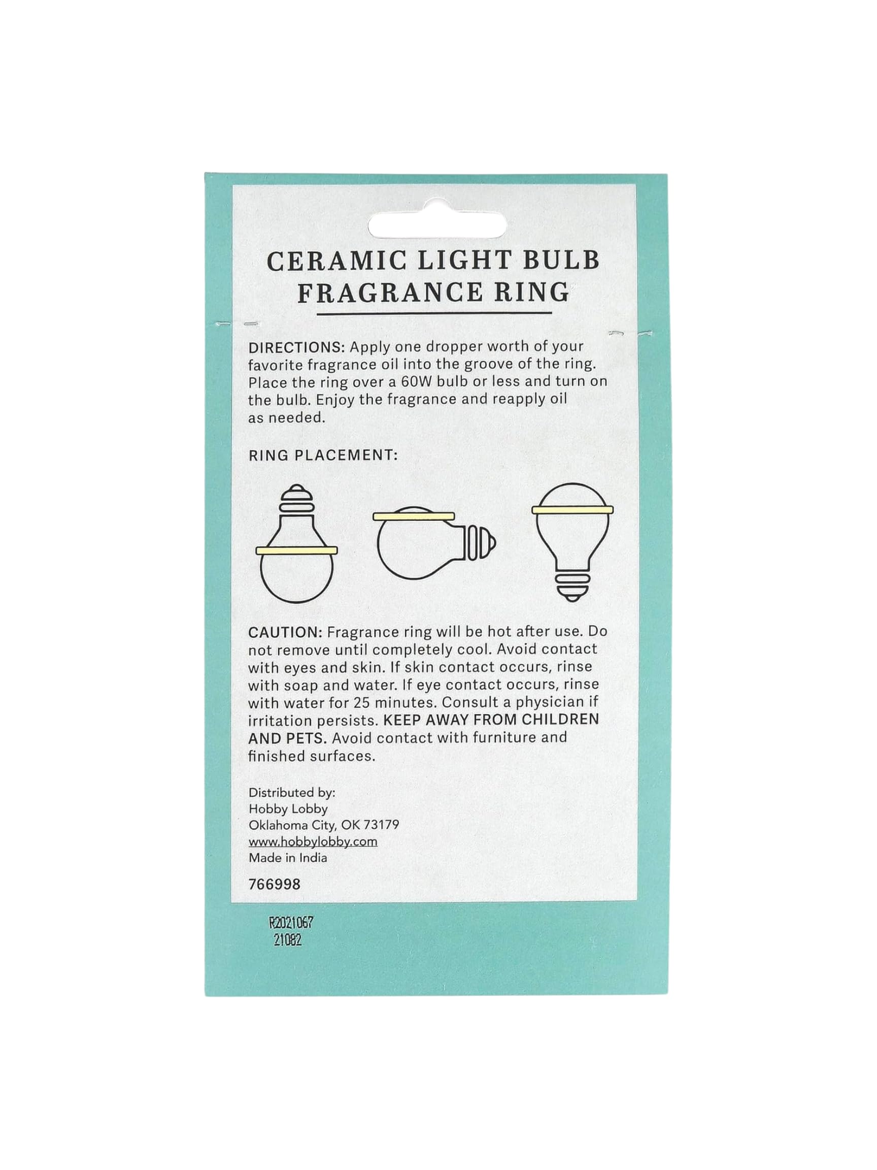 Aromatherapy fragrance ring mounted on a light bulb in a lamp