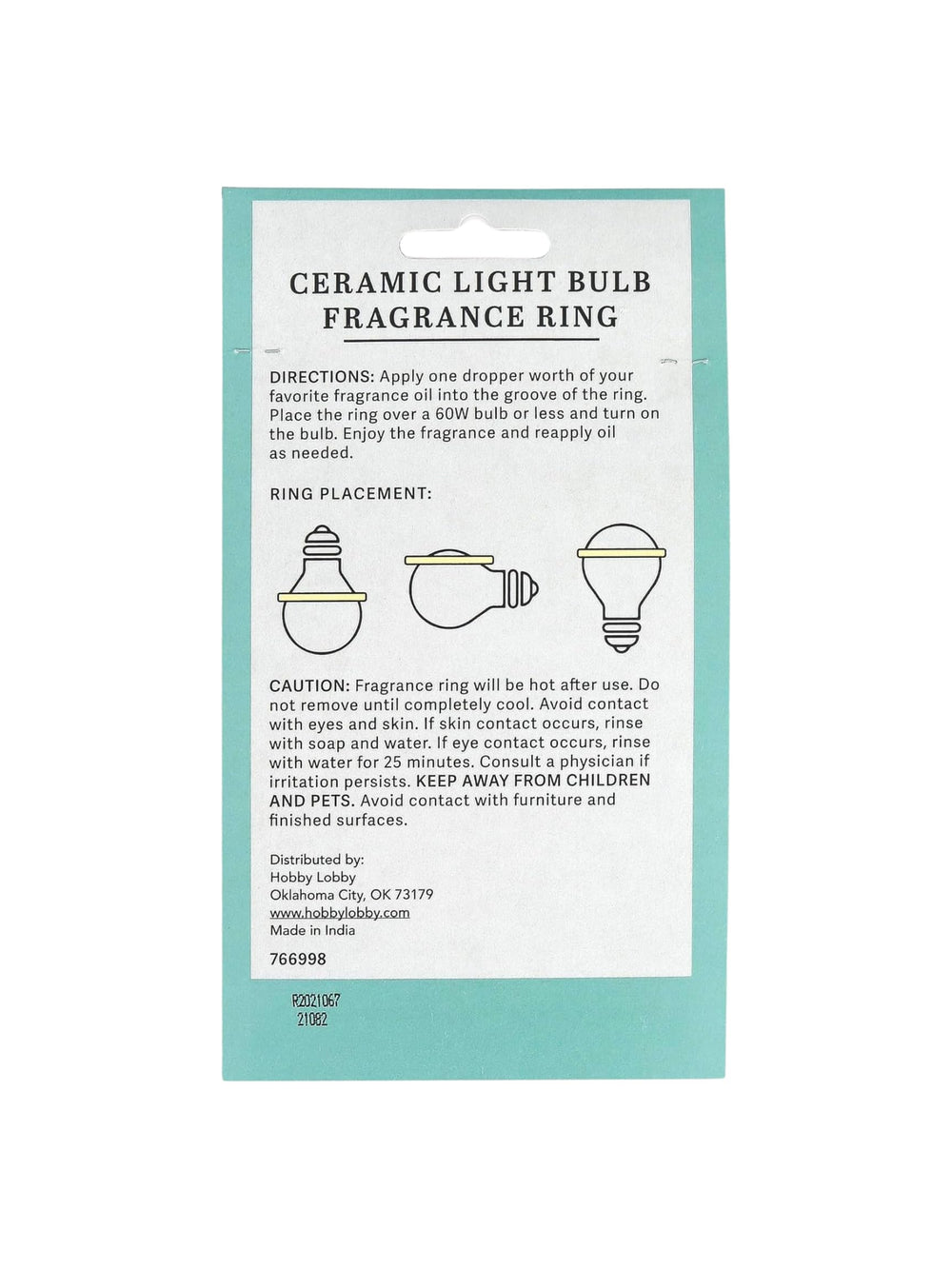 Aromatherapy fragrance ring mounted on a light bulb in a lamp