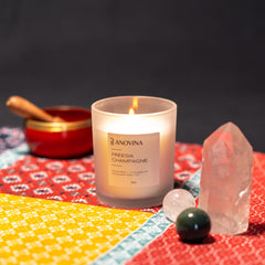 Bedroom setup with Champagne Toast Candle in use