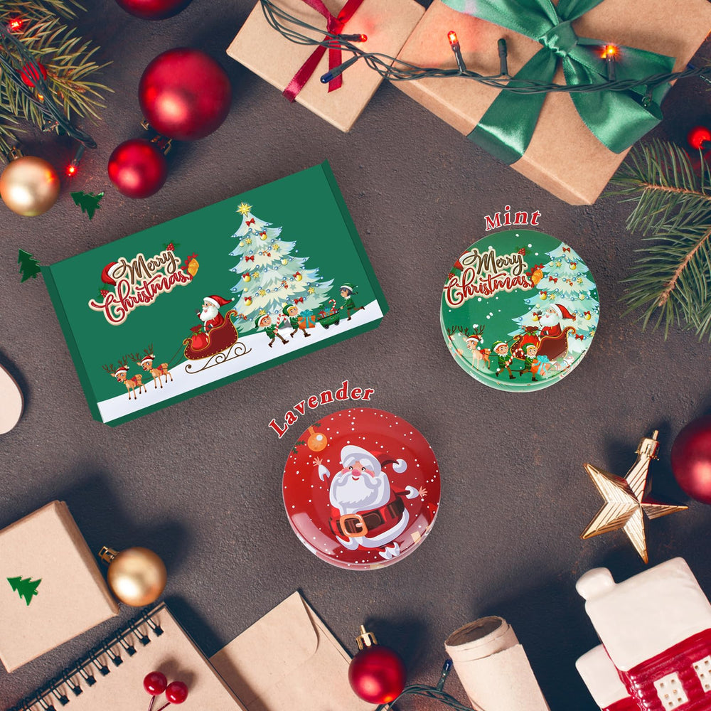 Close-up of two gift candles with festive Christmas patterns