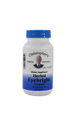 Close-up of Herbal Eye Formula bottle with label and natural ingredients