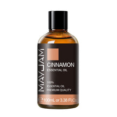Close-up of MAYJAM Cinnamon essential oil bottle