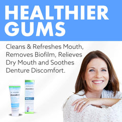 Close-up of Cleanadent toothpaste being applied to a denture surface