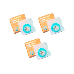 Cocofloss woven dental floss with orange scent on three 33-yard spools