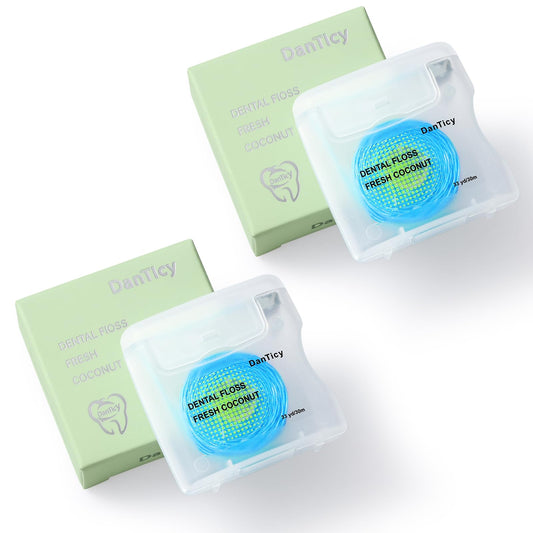 Coconut-oil infused woven dental floss strands