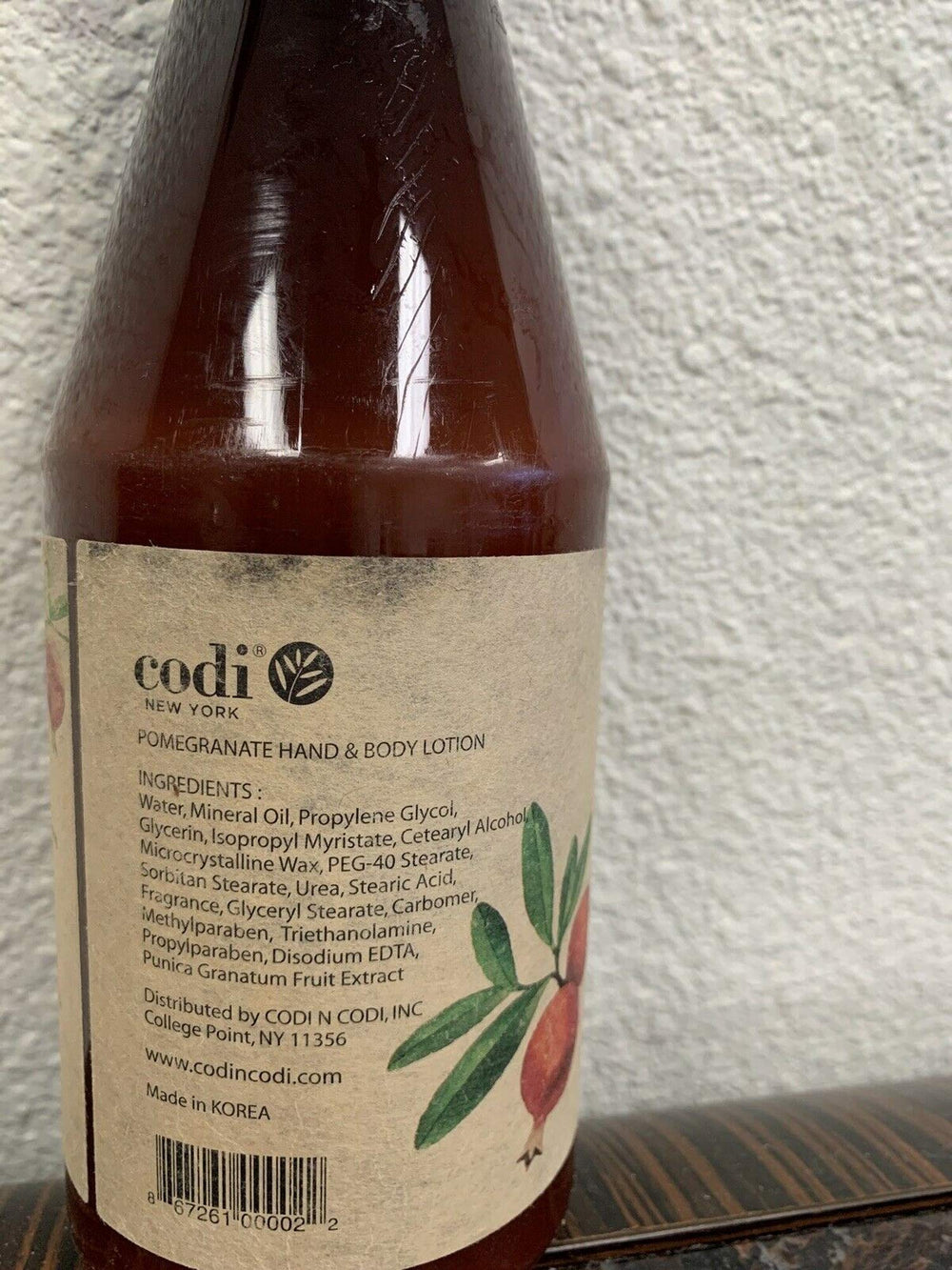 Texture close-up of CODi Pomegranate Lotion on skin