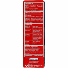 Close-up of Colgate Cavity Protection toothpaste tube showing regular flavor