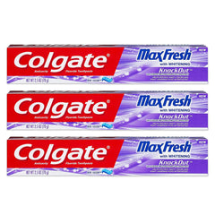 Close-up view of Colgate Max Fresh KnockOut Gel toothpaste tubes in a 3-pack packaging