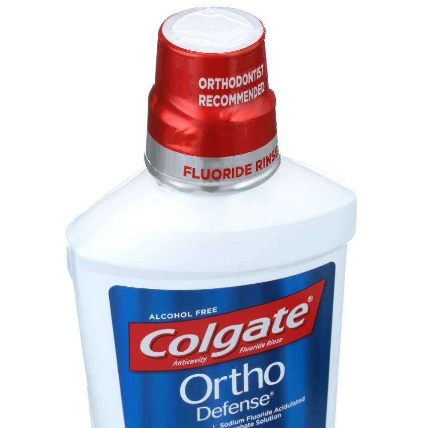 Close-up of Colgate Phos-Flur mint fluoride rinse bottle