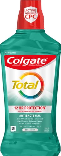 Side view of Colgate Total Advanced Pro-Shield Mouthwash Spearmint 33.8 oz bottle
