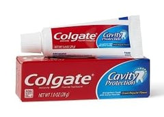 Travel-ready Colgate toothpaste tubes arranged for packing