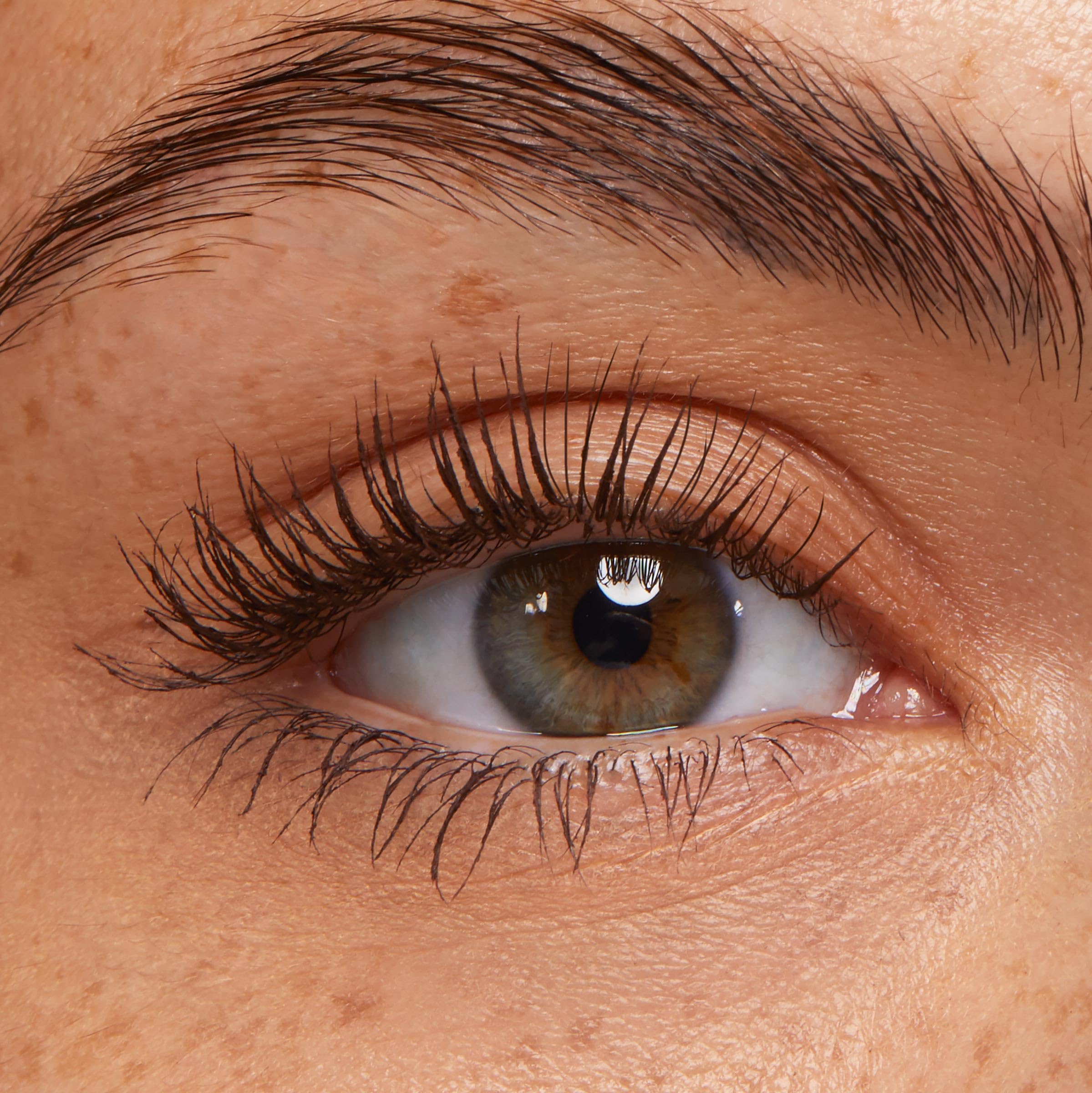 ColourPop Level Up brush sweeping through lashes for lift and length.