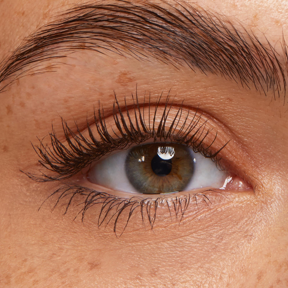 ColourPop Level Up brush sweeping through lashes for lift and length.